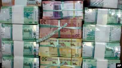 Minister Sudan To Devalue Pound Currency In January File Sudan S New Currency Sits Behind A Window At The Central Bank In Khartoum