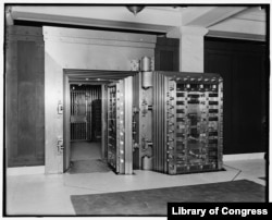 FILE - Twenty-five-ton door, safe deposit vault, main office, Old Colony Trust Company, Boston, Mass.