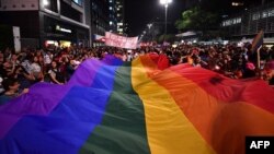 People protest against the decision of a Brazilian judge who approved gay conversion therapy in Sao Paulo, Brazil on Sept. 22, 2017.