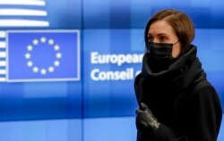 Finland's Prime Minister Sanna Marin leaves the European Council building in Brussels early on October 22, 2021, at the end of the first day of the European Union summit.