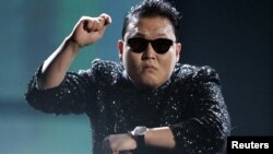 South Korean pop artist Psy performs 'Gangnam Style' at the 40th American Music Awards in Los Angeles, California, November 18, 2012.