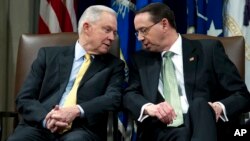 Attorney General Jeff Sessions speaks with Deputy Attorney General Rod Rosenstein, during the opening of the summit on Efforts to Combat Human Trafficking at Department of Justice in Washington, Feb. 2, 2018.