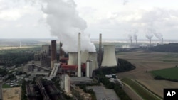 FILE - View to the brown coal power plant of German energy company RWE in Neurath, western Germany, Aug. 27, 2007.
