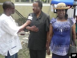 Liberian ambassador to the United States William Bull speaks to VOA's James Butty during independence day festivities