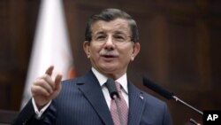 Turkish Prime Minister Ahmet Davutoglu addresses his lawmakers at the parliament in Ankara, Jan. 26, 2016. Davutoglu reiterated Turkey's opposition to including Syrian Kurdish forces at the Geneva talks. 