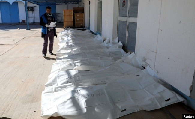 Bags containing dead bodies of migrants who were killed in a truck crash, are seen at a hospital in Bani Walid town, Libya, Feb. 14, 2018.