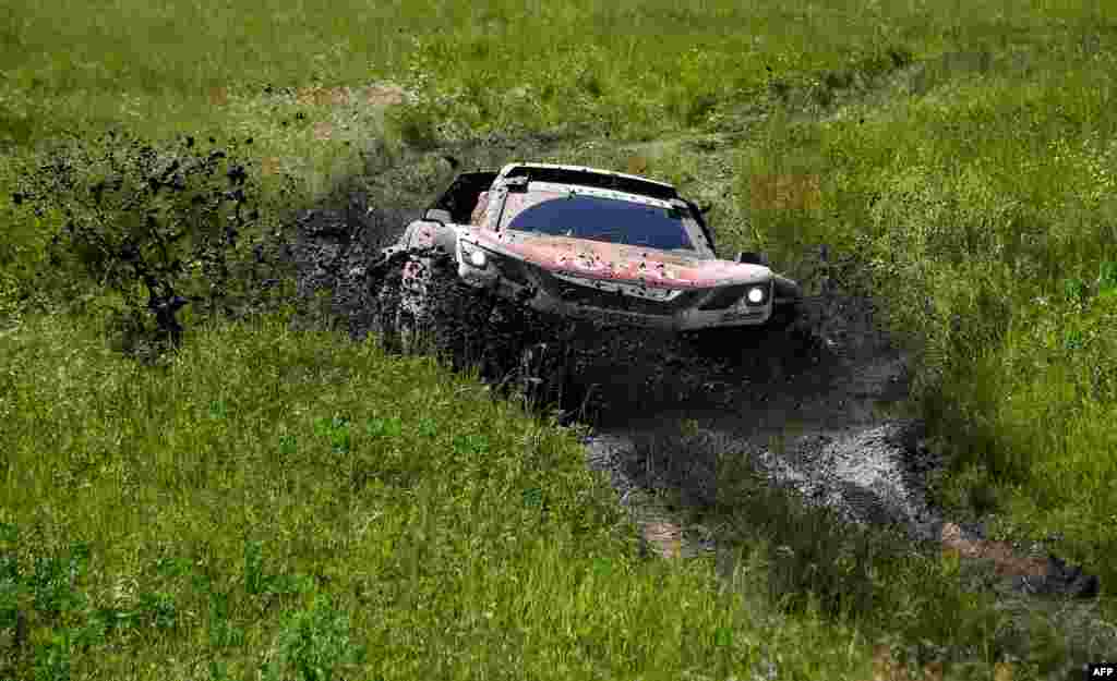 Peugeot&#39;s French driver Sebastien Loeb and French co-driver Daniel Elena compete during the Stage 3 of the Silk Way 2017 between Ufa and Kostanai, in Kazakhstan.