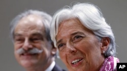 IMF Managing Director Christine Lagarde holds a news briefing at the International Monetary Fund headquarters in Washington July 6, 2011