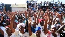 FILE: MDC supporters at a rally in Bulawayo … Human rights monitors warned of an upsurge in political violence in Zimbabwe ahead of a proposed election in 2011.
