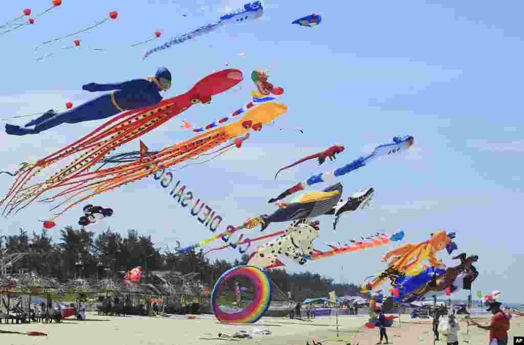 Colorful kites are flown in the sky on Tam Thanh beach during an International Kite Festival in Quang Nam province, Vietnam, June 11, 2017.