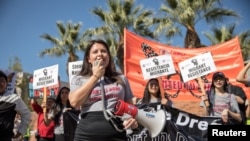 FILE - Melody K., 23, a DACA recipient who was brought to the U.S. when she was 8, speaks during rally in support of a permanent legislative solution for immigrants in Los Angeles, Feb. 3, 2018.