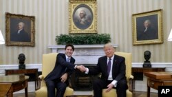 After winning his election, President Donald Trump meets other world leaders. Here, he is pictured with Canadian Prime Minister Justin Trudeau in the Oval Office of the White House in Washington, Feb. 13, 2017. (AP Photo/Evan Vucci)