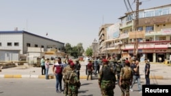 Іракські сили безпеки на місці самогубної атаки