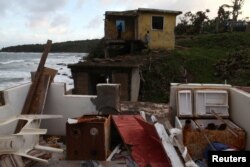 The remains of a house are seen in the El Negro neighborhood in Maunabo, Jan. 27, 2018.