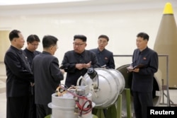 FILE - North Korean leader Kim Jong Un provides guidance on a nuclear weapons program in this undated photo released by North Korea's Korean Central News Agency in Pyongyang, Sept. 3, 2017.