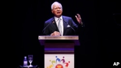 Malaysian Prime Minister Najib Razak speaks at the opening ceremony of the Association of Southeast Asian Nations (ASEAN) summit in Kuala Lumpur, Malaysia, Saturday, Nov. 21, 2015.