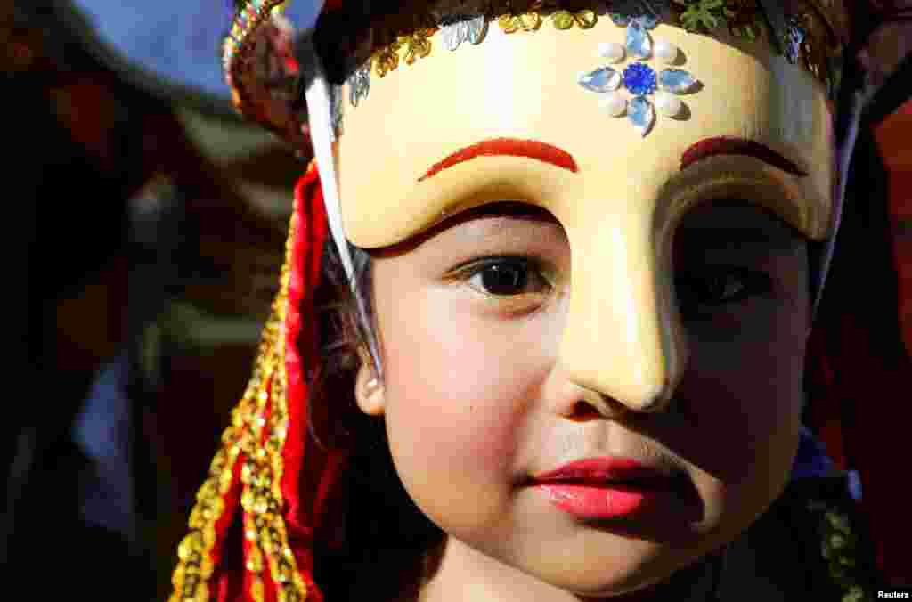 A girl takes part in a local lenten ritual called "Moriones" in Mogpog, Marinduque, Philippines.