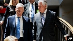 Secretary of State Rex Tillerson, right, and Defense Secretary Jim Mattis arrive on Capitol Hill in Washington, Aug. 2, 2017, to brief the Senate Foreign Relations Committee.