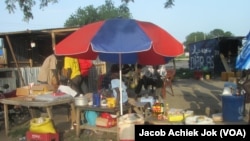 Traders are again selling goods at a market in Bor, June 18, 2014, as the town trickles back to life. Bor was one of the towns hardest hit by fighting in South Sudan.