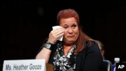 Heather Gooze, a Las Vegas shooting witness, cries as she testifies during a Senate Judiciary Committee hearing on gun legislation on Capitol Hill in Washington, Dec. 6, 2017. 