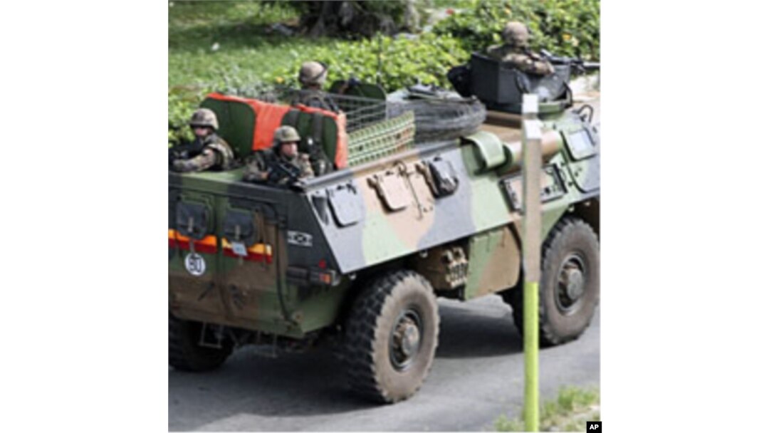 A French armored vehicle patrols a street in Abidjan Mar 31 2011