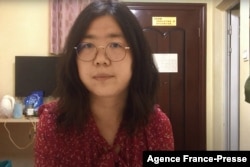 FILE - This file screengrab taken on Dec. 28, 2020 from an undated video shows former Chinese lawyer and citizen journalist Zhang Zhan as she broadcasts via YouTube, at an unconfirmed location in China. (AFP Photo / You Tube)