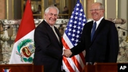 U.S. Secretary of State Rex Tillerson, left, shakes hands with Peru's President Pedro Pablo Kuczynski after a private meeting at the government palace in Lima, Peru, Feb. 6, 2018. 