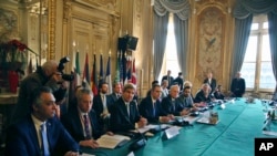 U.S. Secretary of State John Kerry, third left, and France's Foreign Minister Jean Marc Ayrault, fifth left, attend a meeting with others on Syria in Paris, Saturday, Dec. 10, 2016. 