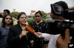 Farha Faiz, a Supreme Court lawyer, speaks to media after the apex court declared "Triple Talaq," a Muslim practice that allows men to instantly divorce their wives, unconstitutional in its verdict, in New Delhi, India, Aug. 22, 2017. The court also requested the government legislate an end to the practice.