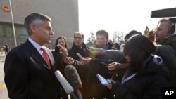 U.S. Ambassador to China Jon Huntsman speaks to journalists in front of the Beijing High People's Court after an appeal of Xue Feng in Beijing, Feb. 18, 2011.