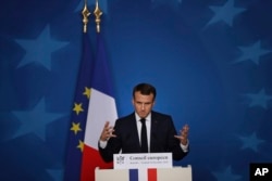 French President Emmanuel Macron speaks during a media conference during an EU summit in Brussels, Dec. 14, 2018.