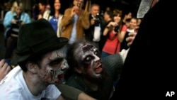 People dressed up as zombies during a 'Zombie Walk', in Belgrade, Serbia, Oct. 19, 2013.