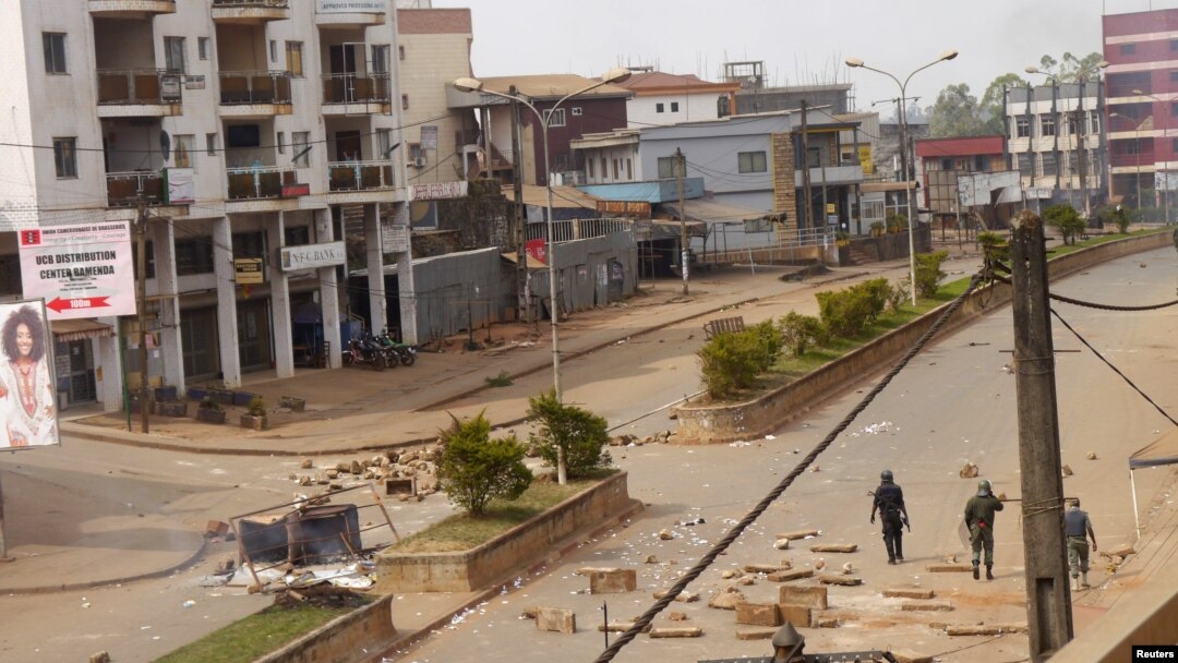 Soldiers clear a road in Bamenda, Cameroon, December 8, 2016.