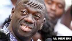 FILE: Uganda's main opposition leader, Kizza Besigye of the Forum for Democratic Change (FDC) party, speaks to the media at the high court, in the capital Kampala, where he was charged with treason 10.4.2016