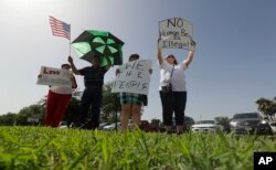 Protesters gather near a U.S. Customs and Border Protection station to speak out against immigration policy, June 30, 2018, in McAllen, Texas.
