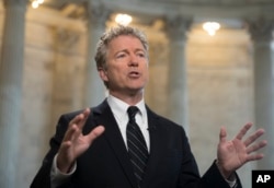 FILE - Sen. Rand Paul, R-Ky., speaks during a TV news interview on Capitol Hill in Washington, March 21, 2018.