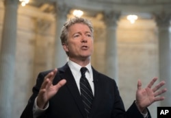 FILE - Sen. Rand Paul, R-Ky., speaks during a TV news interview on Capitol Hill in Washington.