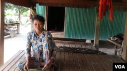 Yim Rom, 57, a villager in a remote area of Kampong Thom province, sold her land in July to pay a debt to a microfinance institution (MFI) after taking out the loan for more than a year, Kampong Thom, Cambodia, August 28, 2018. (Sun Narin/VOA Khmer) 