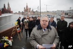 U.S. Ambassador to Russia John Tefft speaks to journalists at the place where Russian opposition leader Boris Nemtsov was gunned down two years ago, next to the Kremlin Wall, in Moscow, Russia, Feb. 27, 2017.