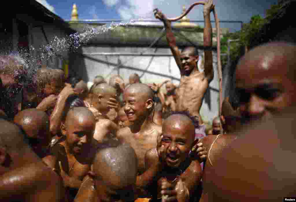 Young Hindu priests take a holy bath together as part of a ritual at the Janai Purnima Festival (Sacred Thread Festival) on the premises of Pashupatinath Temple in Kathmandu, Nepal. 