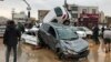 Vehicles are piled up on a street after a flash flood in the southern city of Shiraz, Iran, March 25, 2019.