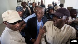FILE - Haiti's President-elect Jovenel Moise returns from the Cabinet d'instruction to the Public Prosecutor's Office in Port-au-Prince, Jan. 25, 2017. 