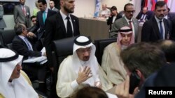 FILE - Saudi Arabia's Oil Minister Khalid al-Falih talks to journalists at the beginning of an OPEC meeting in Vienna, Austria, June 22, 2018.