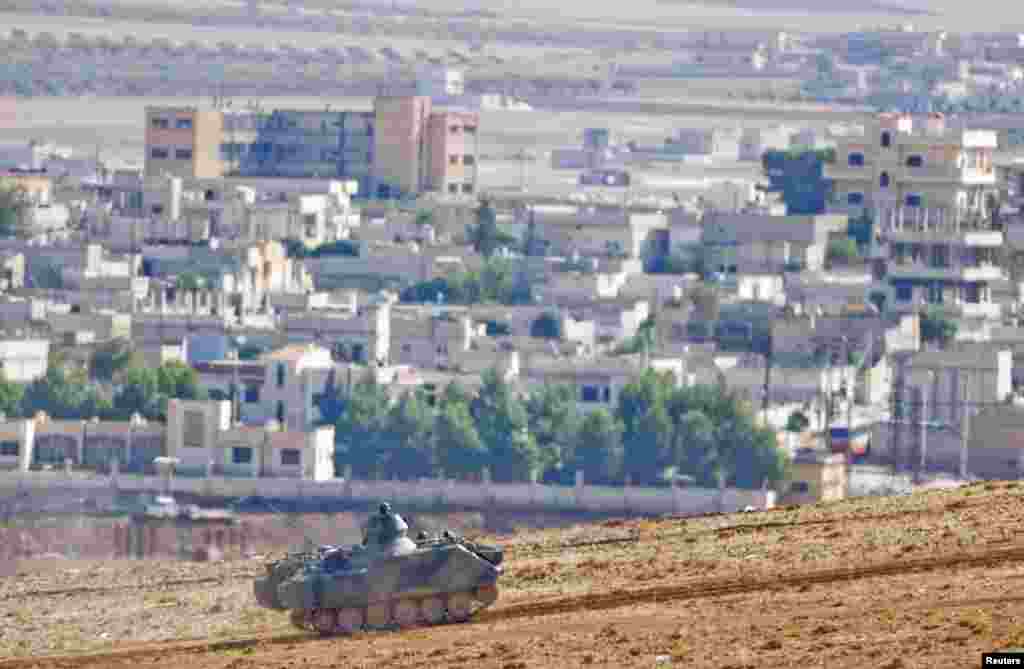 A Turkish military armored vehicle patrols near the Turkish-Syrian border, Oct. 16, 2014. 