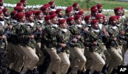 FILE - Pakistani commandos from the Special Services Group march during a military parade in Islamabad, March 23, 2016.