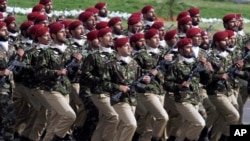 FILE - Pakistani commandos march during a military parade in Islamabad, March 23, 2016. Gul Bukhari, a Pakistani journalist who is an unusually vocal critic of Pakistan's powerful military, was freed Wednesday, several hours after being abducted.