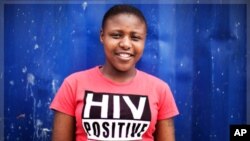 Nandi Makhele, 25, wears a T-shirt that says she is HIV-positive, in Cape Town's Khayelitsha township. About 5.6 million people live with HIV/AIDS in South Africa - more than in any other country.