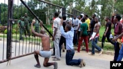 University of Zambia students "surrender" to police in Lusaka after the Zambian government announced the university's closure, Feb. 3, 2016.