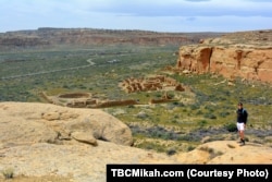 National parks traveler Mikah Meyer overlooks the ancient stone structures at Chaco Culture National Historical Park in northern New Mexico.