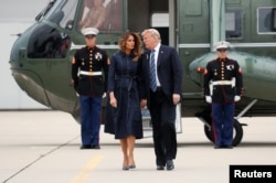 FILE - U.S. President Donald Trump and first lady Melania Trump hold hands and talk as they walk from the Marine One helicopter to Air Force One at John Murtha Johnstown-Cambria County Airport prior to departing Johnstown, Pennsylvania, Sept. 11, 2018.